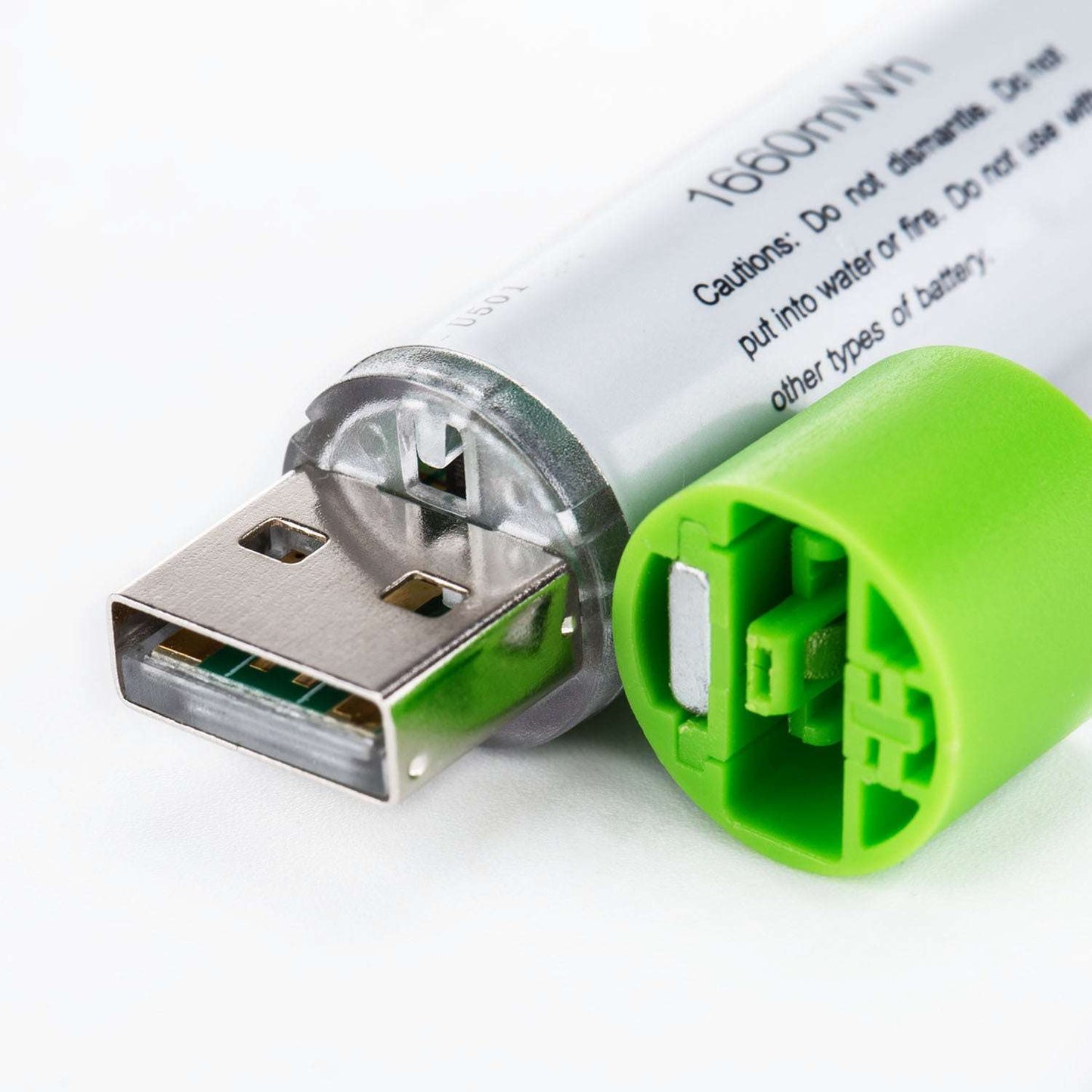 Close-up of a USB battery pack with green casing on a white background