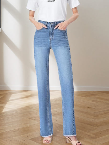 Women's light blue wide-leg denim pants with button fly, belt loops, and front patch pockets.