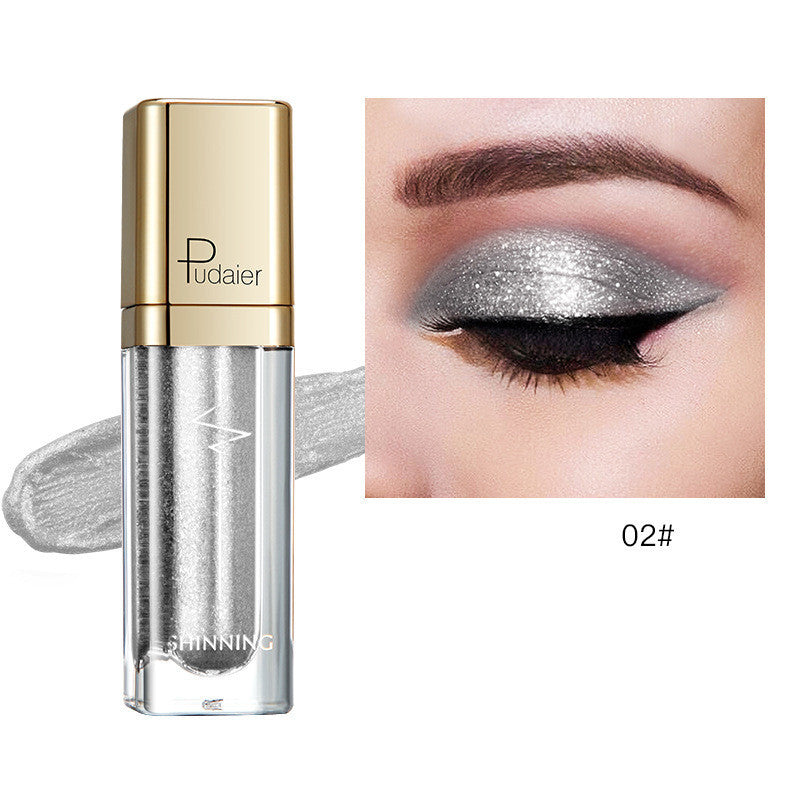 Glitter eyeshadow tube with silver shimmer and matching eyelid swatch, Tudaier