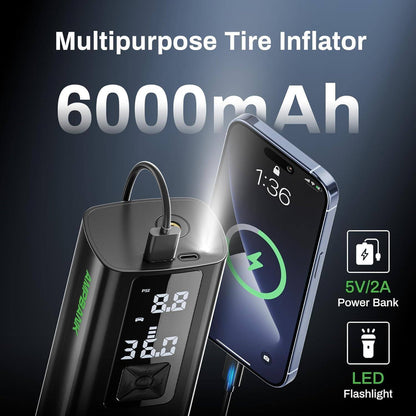 Black portable tire inflator with screen showing PSI reading, orange nozzle and hose
