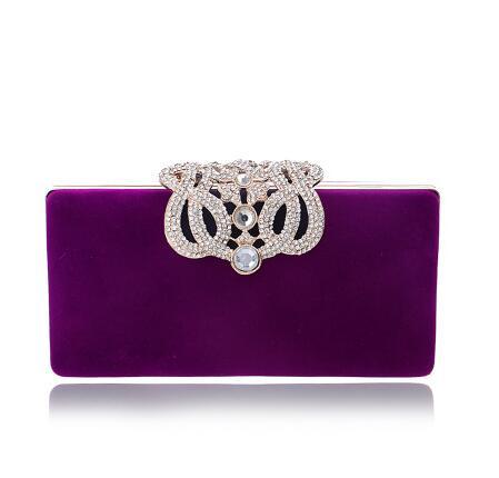 Rectangular purple evening clutch with rhinestone ornate clasp and faux pearl