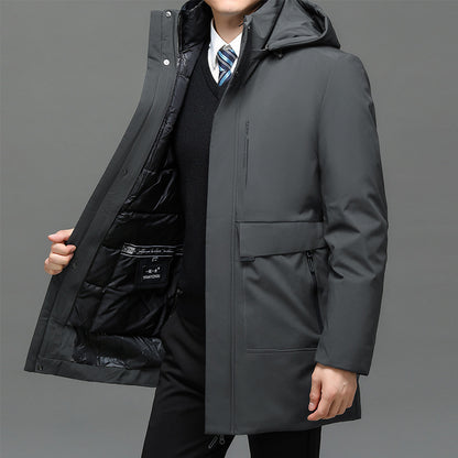 Person wearing a gray coat with a gray background
