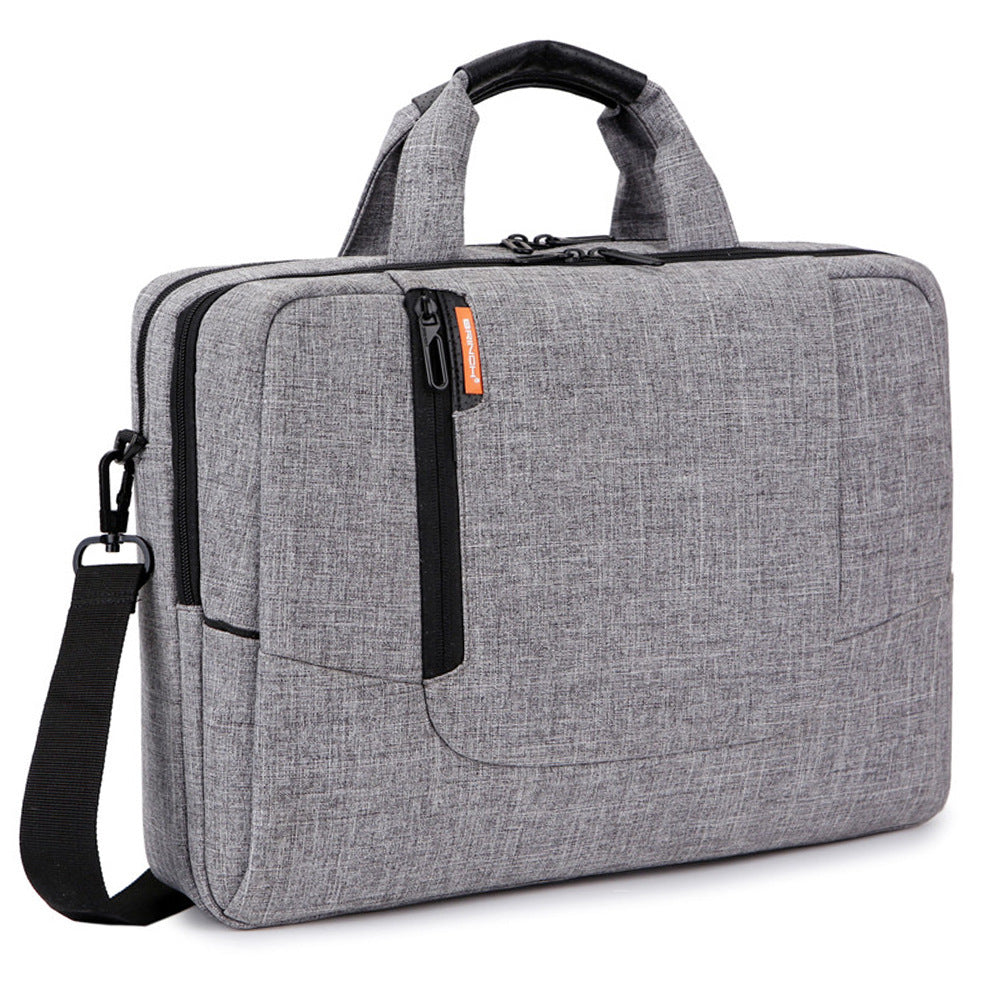 Gray laptop briefcase with top handle, front zip pocket, and crossbody strap