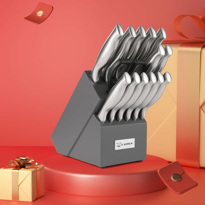 Stainless steel knife set on gray block with assorted knives