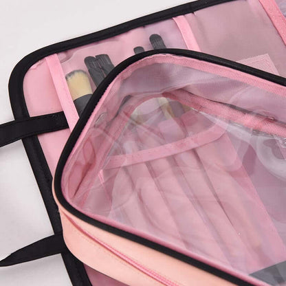 Cosmetic storage bag showing clear inner pouch with pink lining and black outer trim.