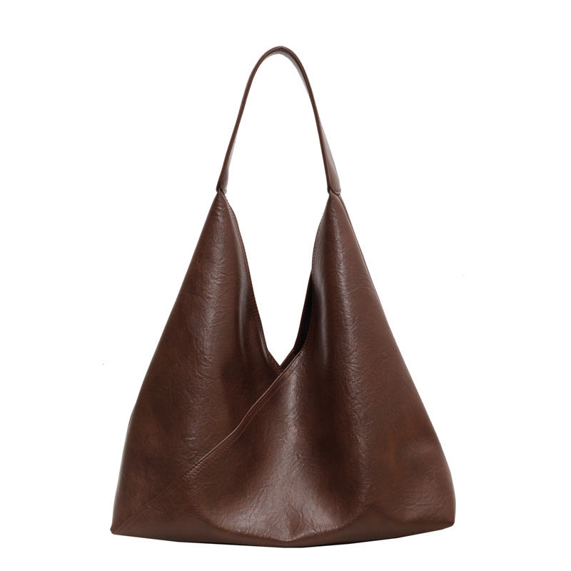 Dark brown slouchy shoulder bag with wide U-shaped opening and top handles