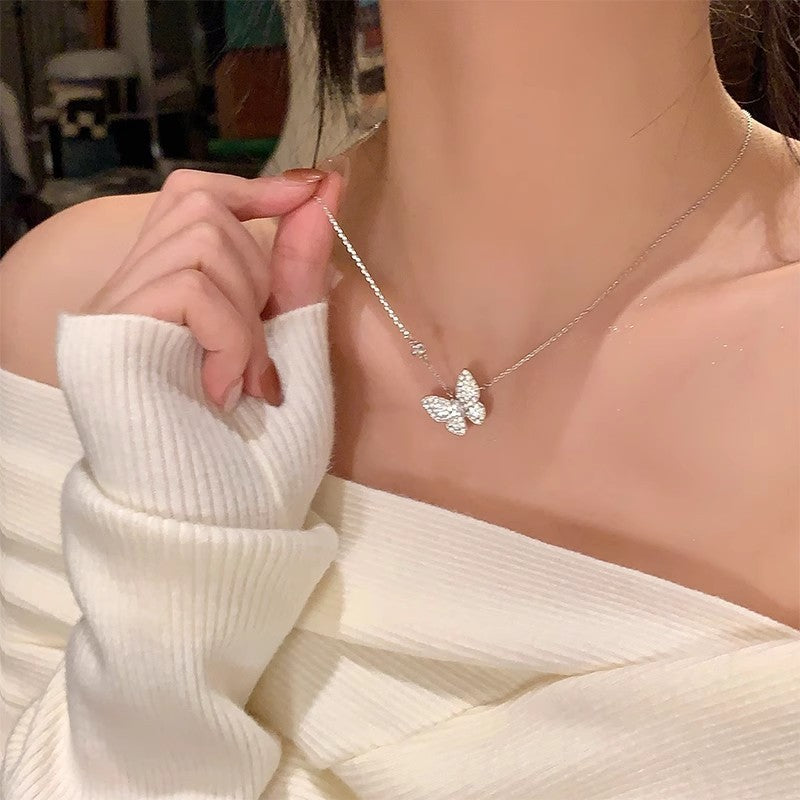 Butterfly pearl pendant necklace with fine chain and butterfly centerpiece