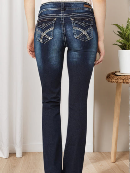 Blue embroidered pocket jeans, back view with stitched back pockets and belt loops