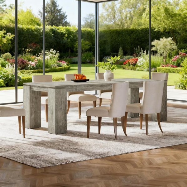 Rectangular light gray wood dining table with dining chairs and four thick legs