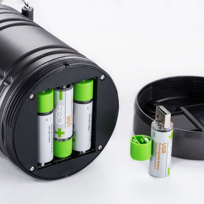 Black battery charger with green and white batteries on a white background