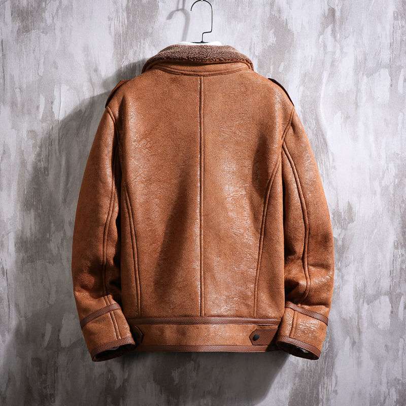 Brown leather jacket on a gray textured background