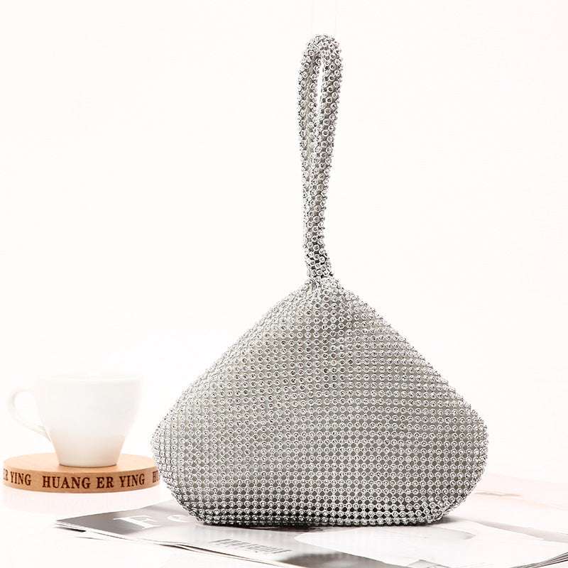 Rhinestone studded banquet clutch bag with curved top handle, silver tone