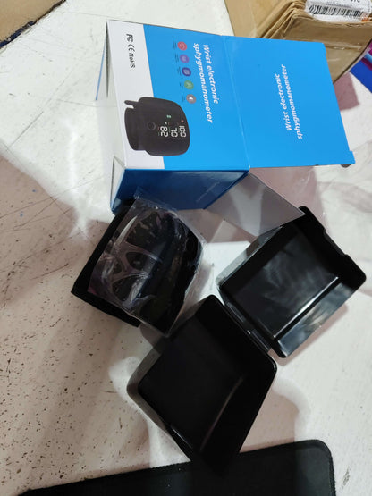 Blue retail box with black blood pressure monitor device and charging cable