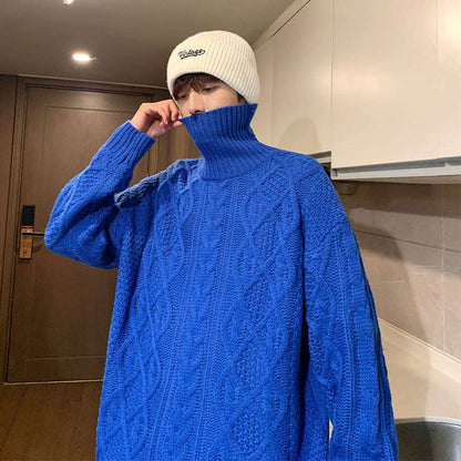 Blue knit turtleneck sweater with cable diamond pattern and ribbed collar