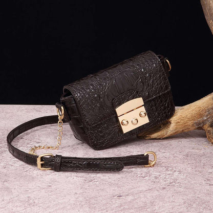 Dark brown croc-textured crossbody bag with flap, gold-tone lock, and chain strap