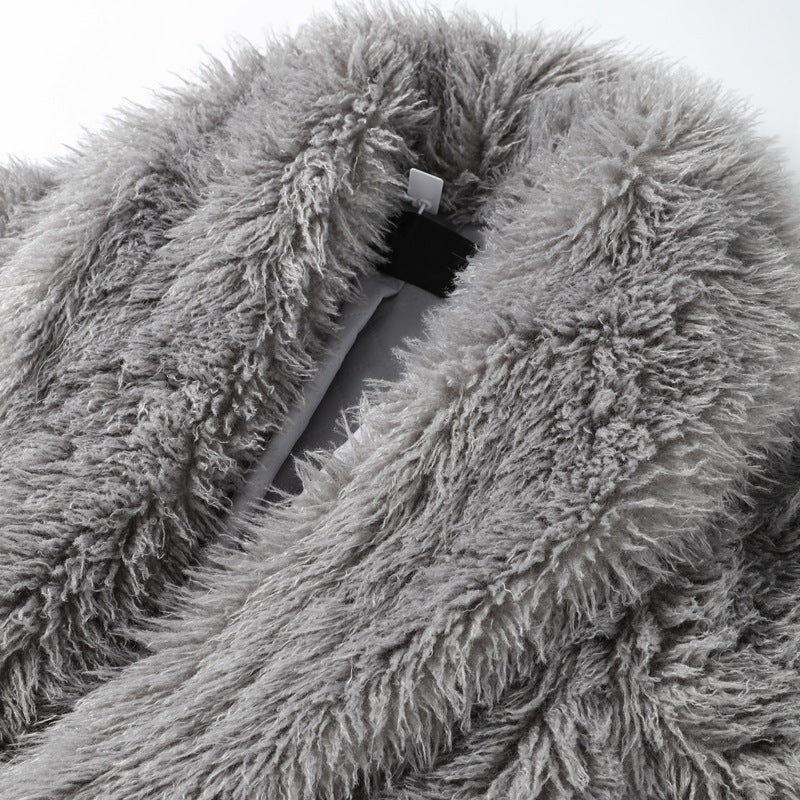 Women’s mid-length faux fur coat lining detail, gray textured fabric and hidden snap tab.