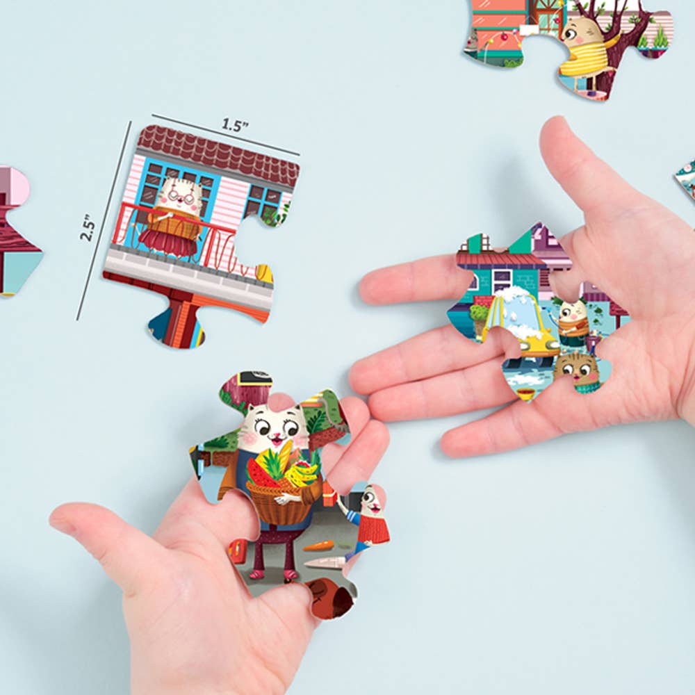 Colorful 3D paper toys being held by hands on a light blue background