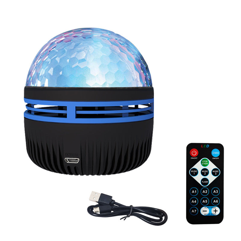 LED star projector lamp with blue faceted dome, black ribbed base, includes USB cable and remote