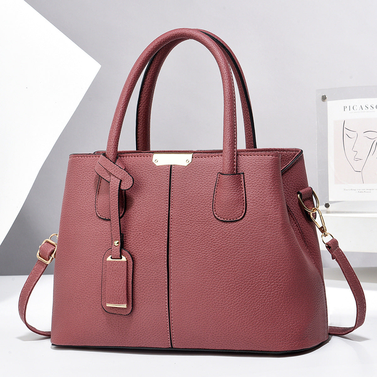 PU leather tote bag with top handles and crossbody strap, mauve pink finish