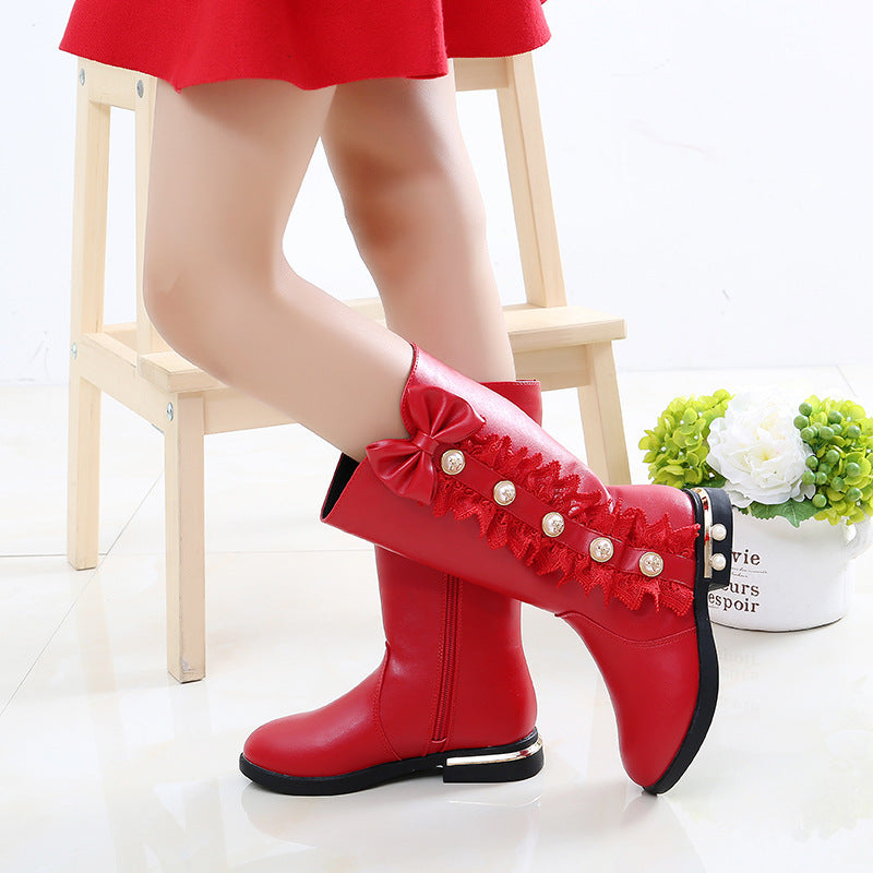 Girls' fleece-lined boots in red with side ruffles, bow, and pearl-button accents