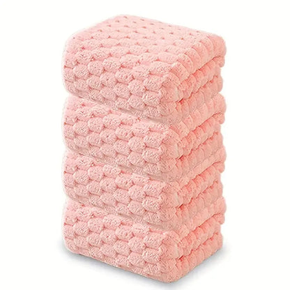 Waffle bath towel set, folded stack of pink towels with waffle texture