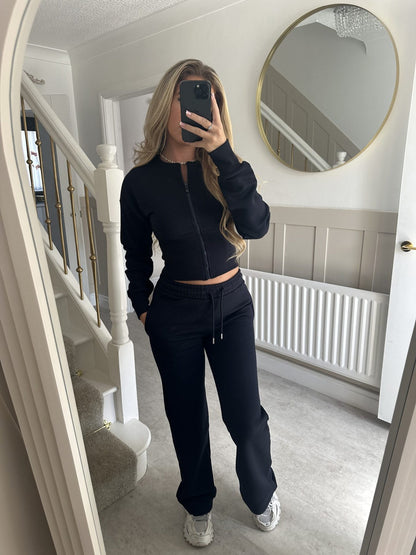 Women’s zip-front sweatshirt and jogger set in navy, two-piece outfit.