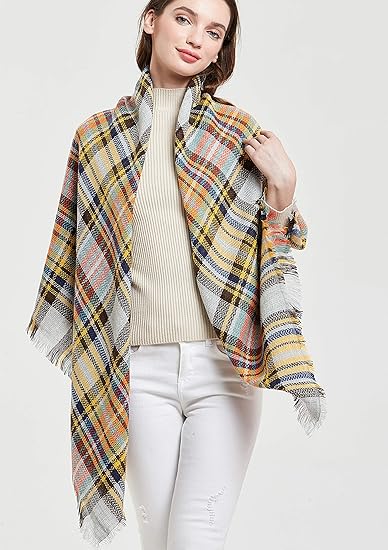 Fringed plaid scarf, yellow blue and white tones draped on model