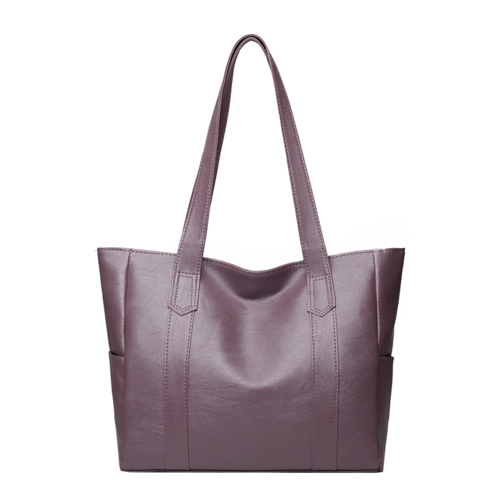 Purple leather tote bag with wide handles and structured front panels