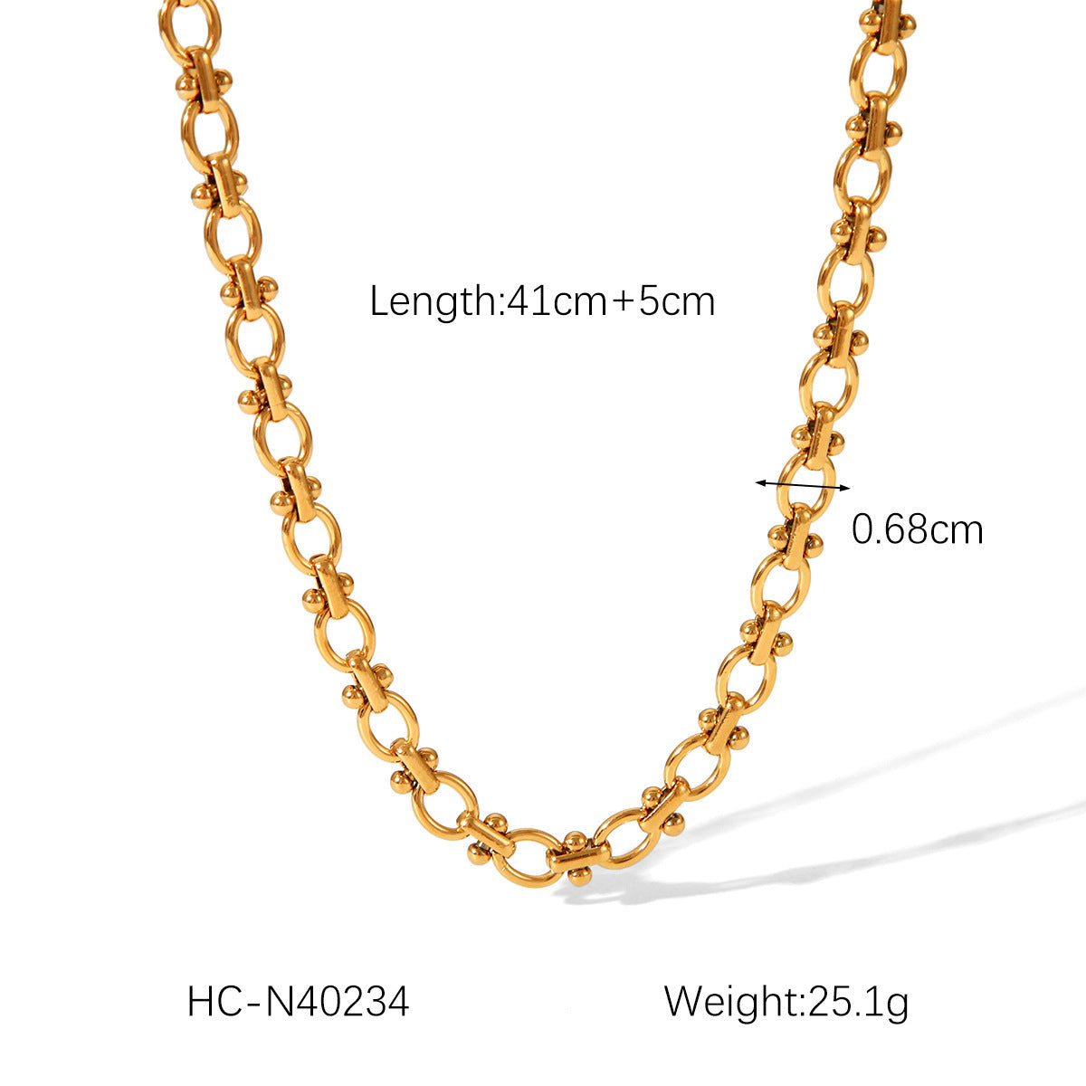 Gold-plated oval link chain necklace with small bead accents, curved drape