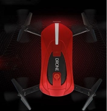 Red quadcopter drone with teal center panel and four propellers, top-down view