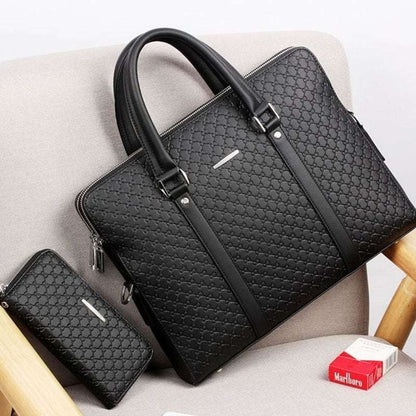 Black embossed letter pattern briefcase with zipper top and adjustable shoulder strap