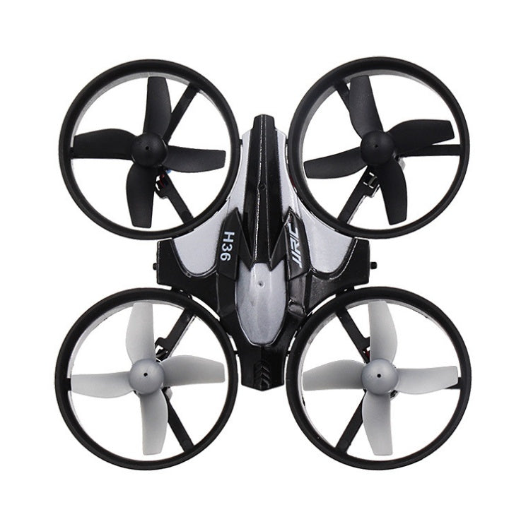 Gray and black mini quadcopter drone with four white-blade propellers and black frame