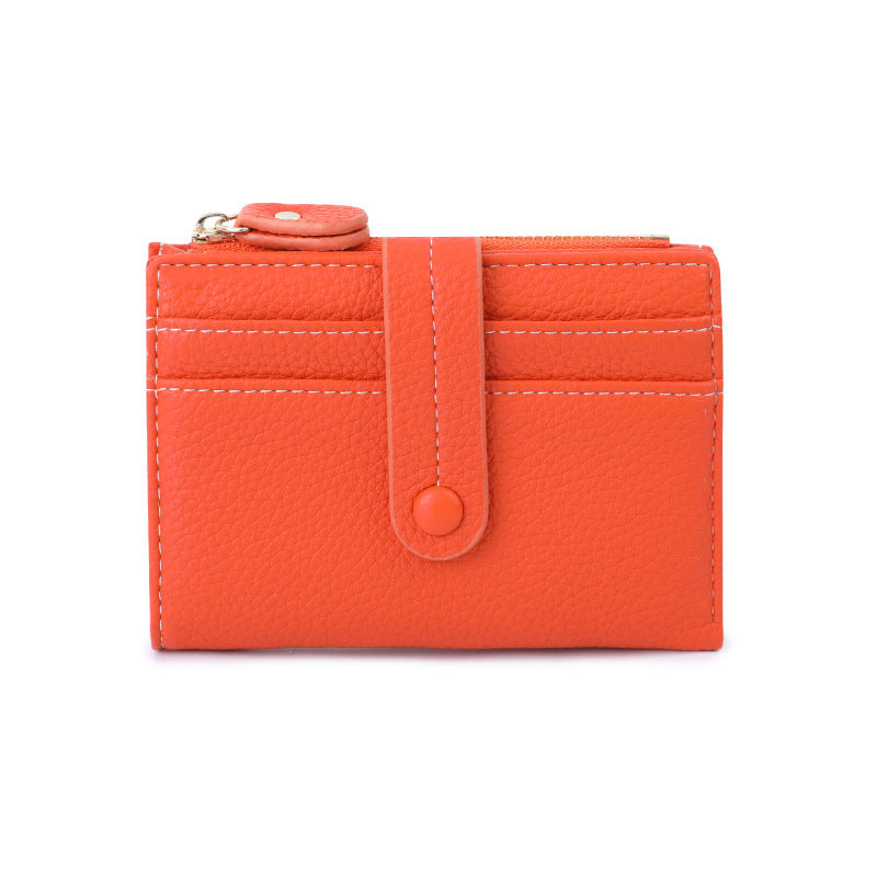 Orange/red short wallet with card slots, snap button tab, and coin zipper pocket