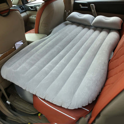 Light gray ribbed inflatable car mattress with two raised pillows