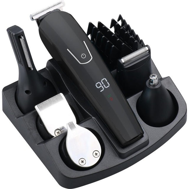 Set of grooming tools including a hair trimmer, comb, and other attachments on a white background.