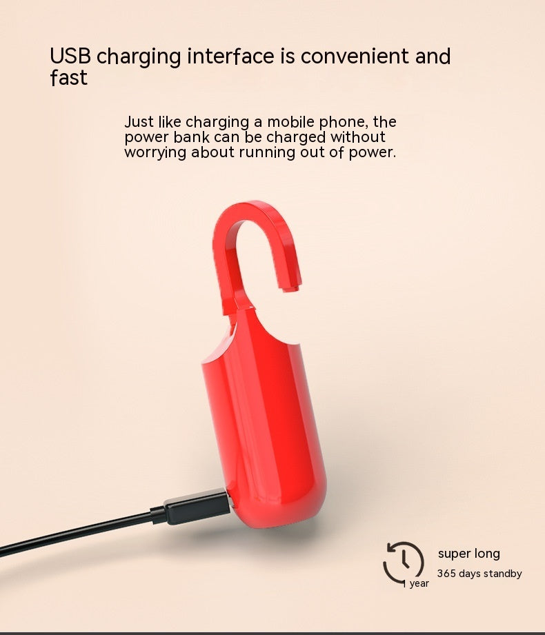 Red power bank with USB charging interface on a beige background
