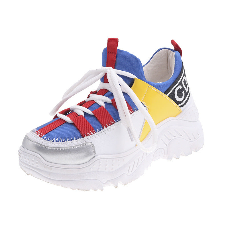 White lace-up chunky sneakers with blue, yellow, red panels and thick sole