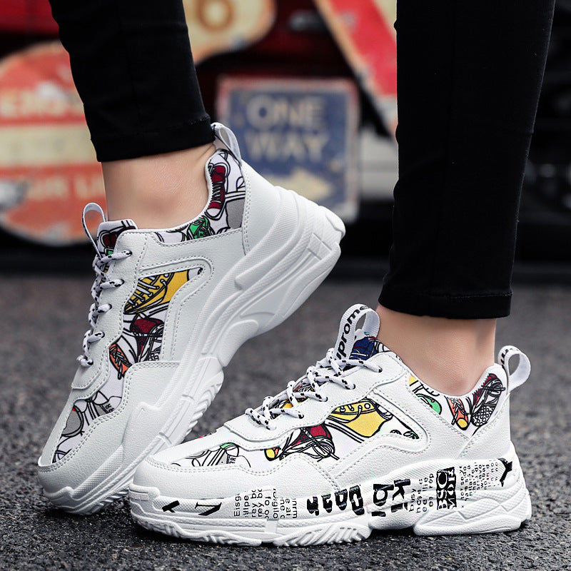 White running sneakers with colorful comic graphics and textured thick sole