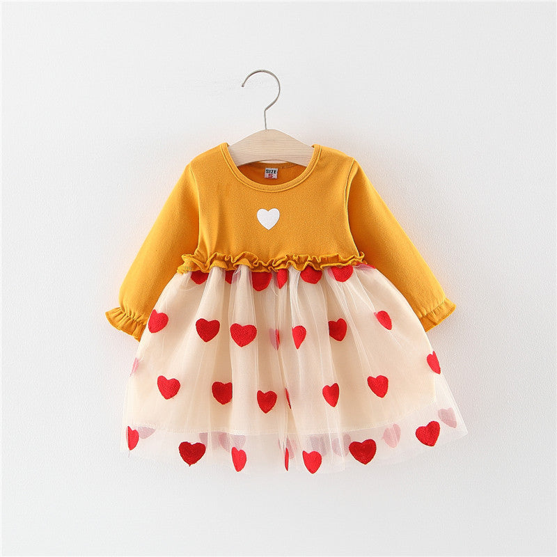 Baby girl dress in mustard yellow with long sleeves and white tulle skirt with red hearts