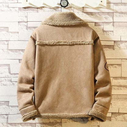 Beige jacket with fur trim hanging against a wooden paneled wall.