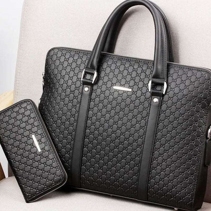 Black embossed letter pattern briefcase with front pocket, top zipper, and carry handles
