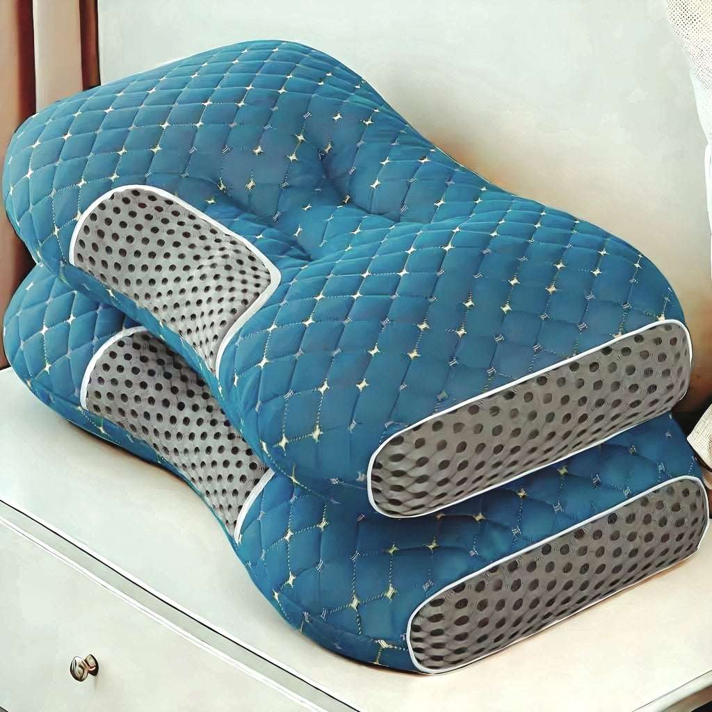 Blue quilted massage pillow pair with perforated side panels and curved inner cutout
