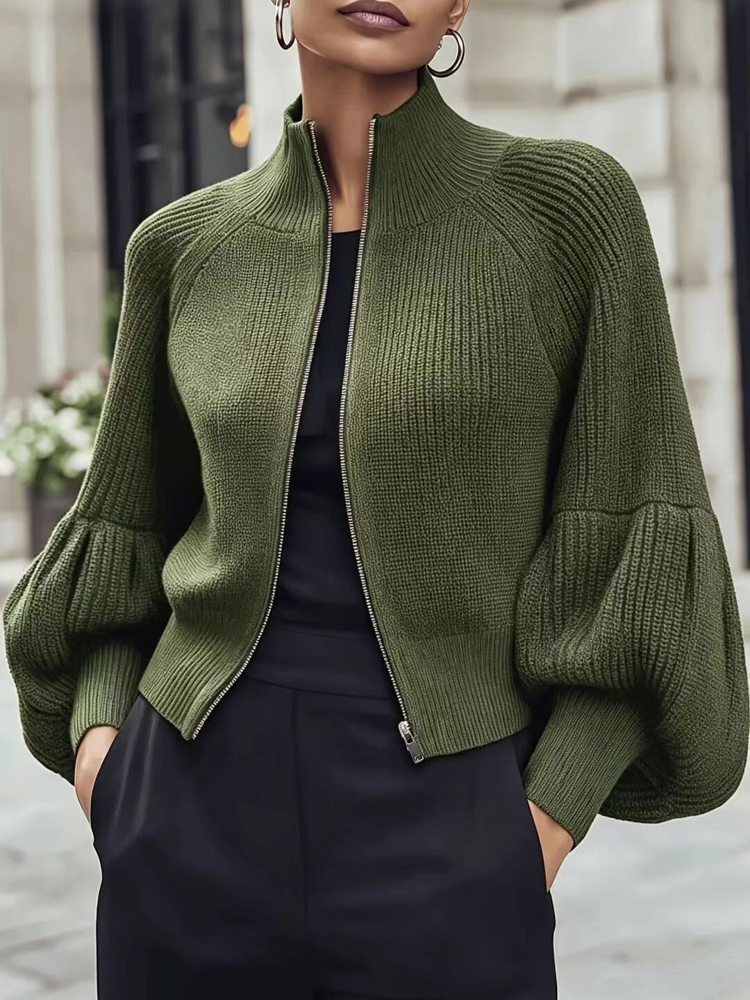 Forest green textured knit zip-front sweater with lantern sleeves and ribbed turtleneck collar