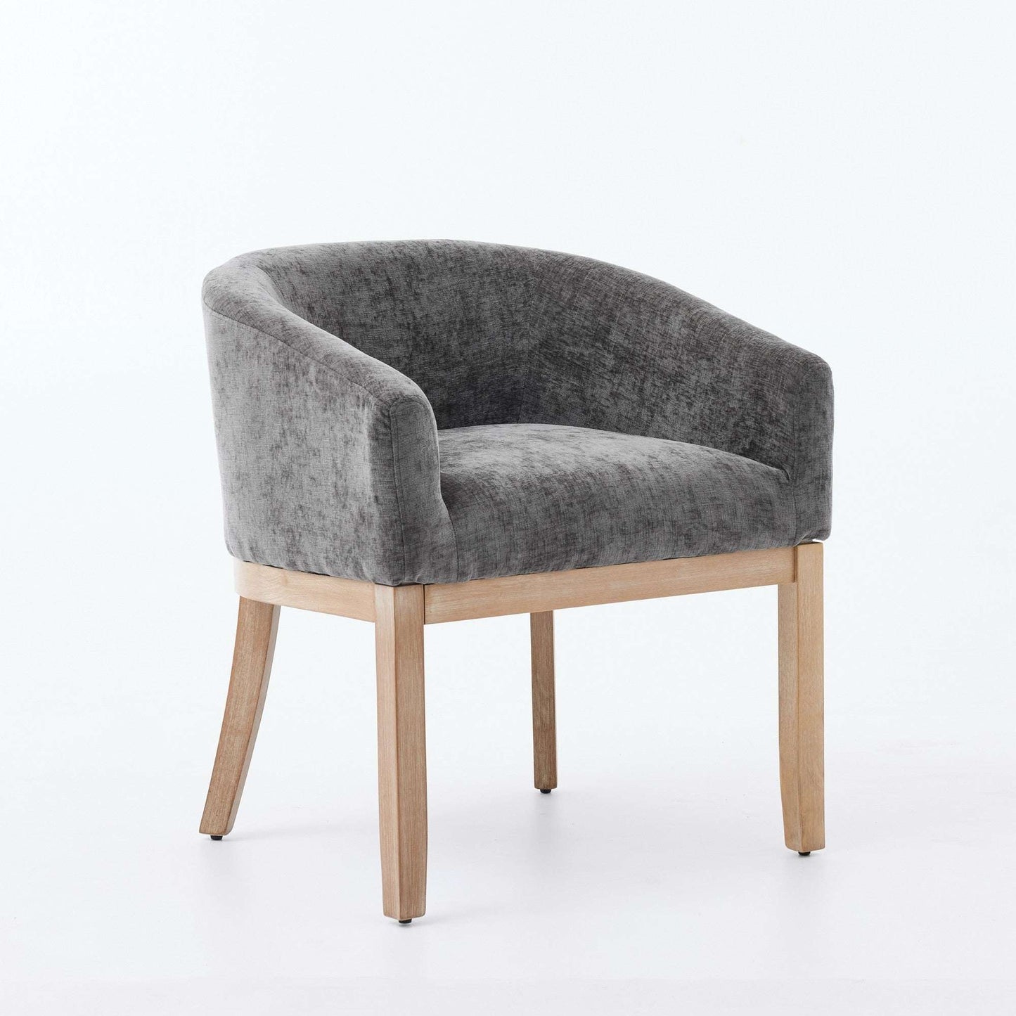 Gray chenille dining chair with curved arms and light hardwood frame