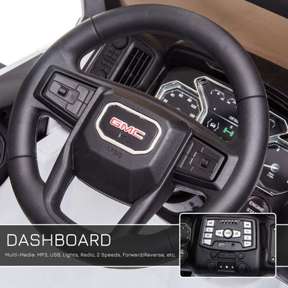Kids ride-on truck steering wheel and dashboard with GMC logo and control buttons