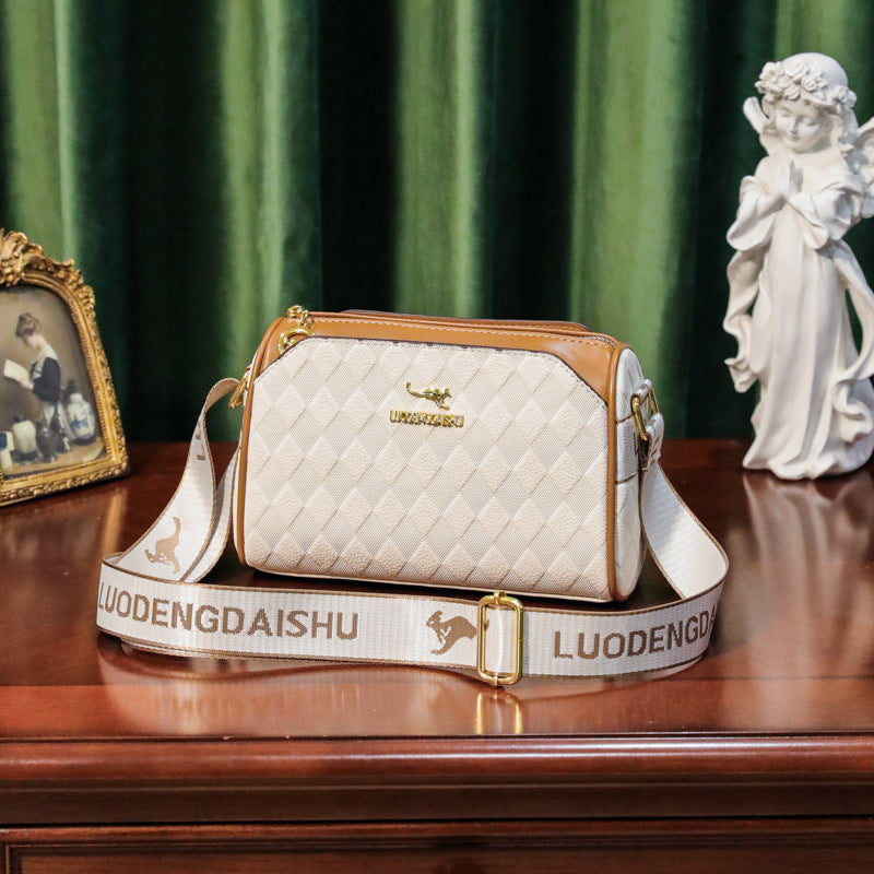 White textured leather shoulder messenger bag with gold logo and wide crossbody strap