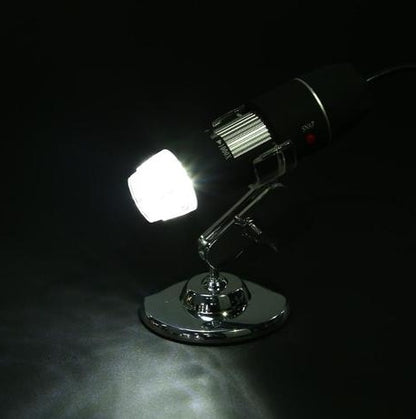 Chrome spotlight with a bright light on a dark background