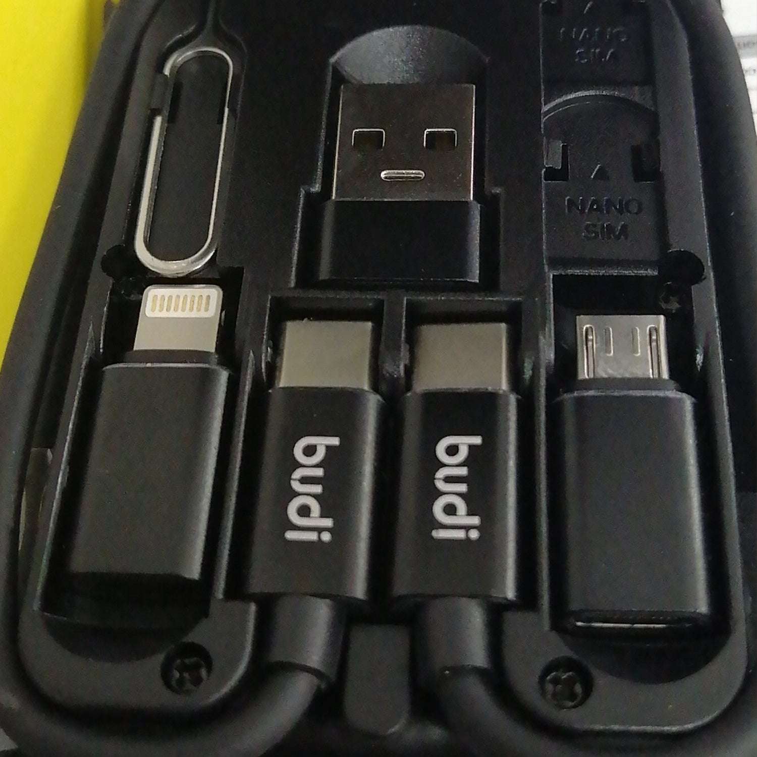 Set of electronic connectors including USB, micro USB, and Lightning cables with 'budi' branding.