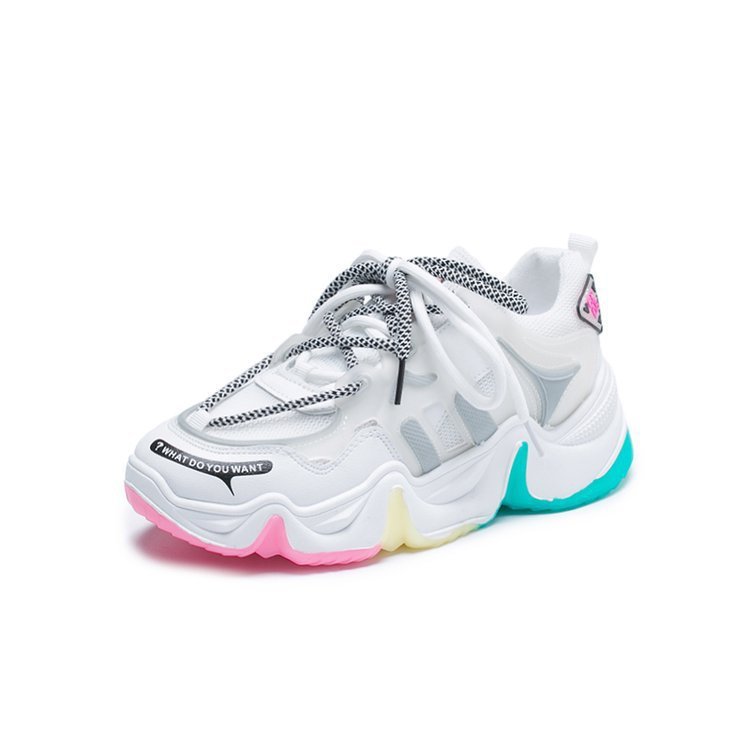 White platform sneaker with grey laces, teal outsole accent, and pink side trim