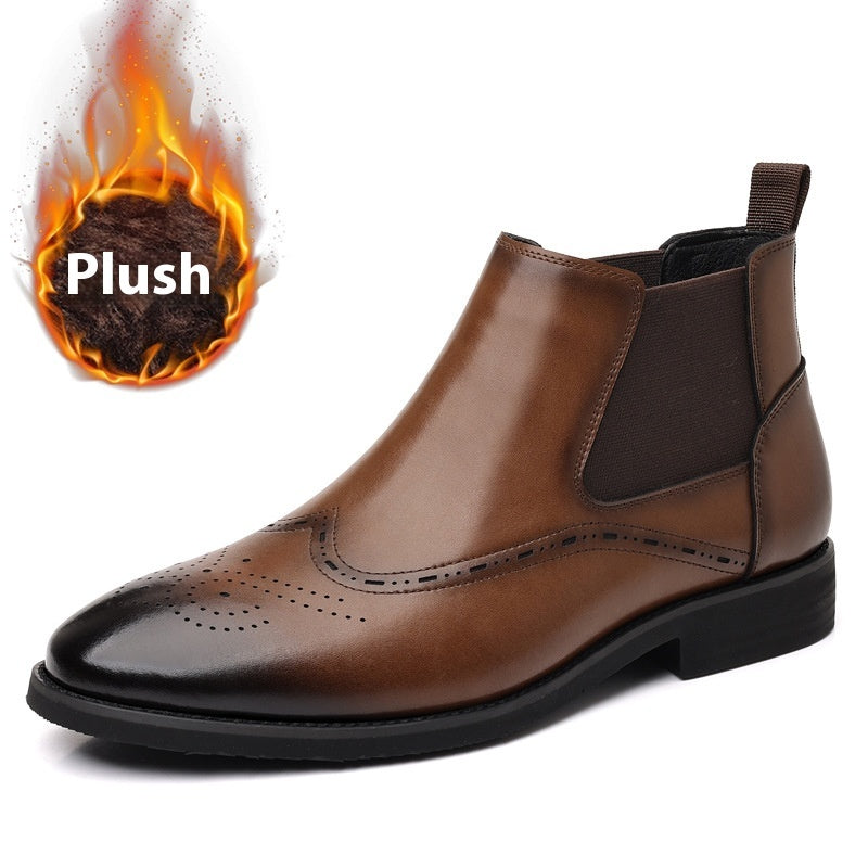 Brown Chelsea boots with elastic side panels and brogue perforation detail